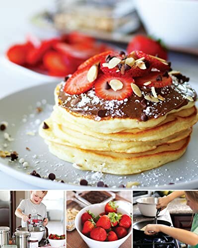 Stack of pancakes topped with strawberries, chocolate chips, and almonds.