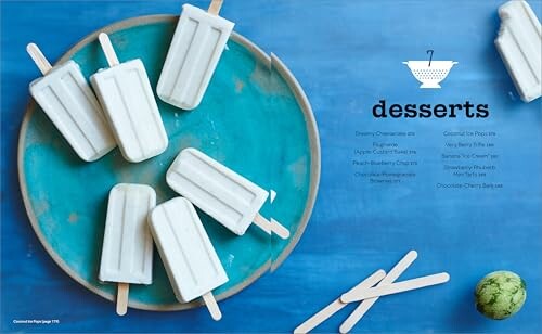 Vanilla popsicles arranged on a blue plate with dessert text.